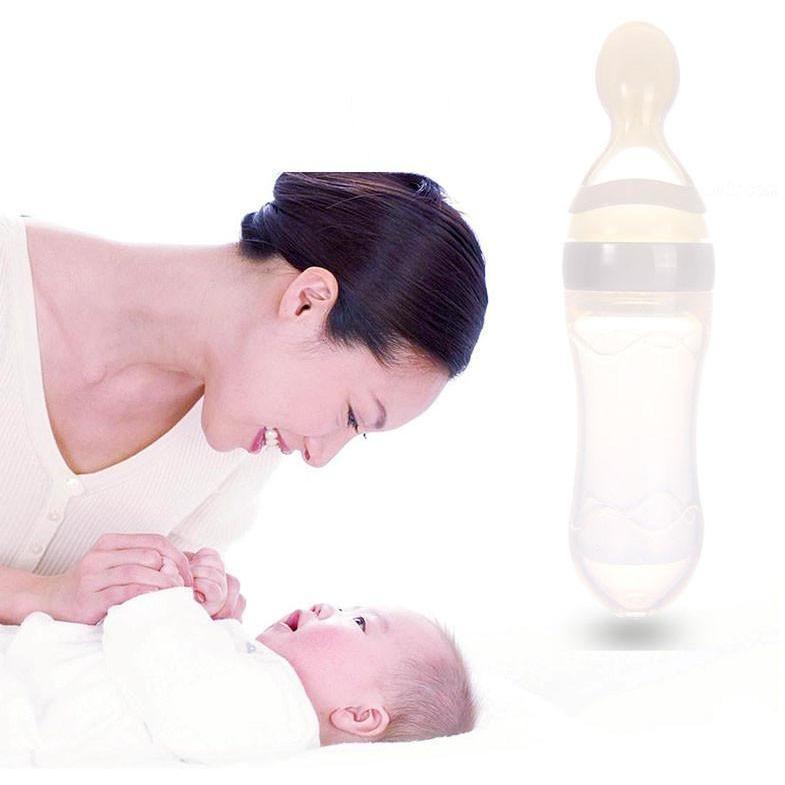 Feeding Bottle With Spoon Dispenser